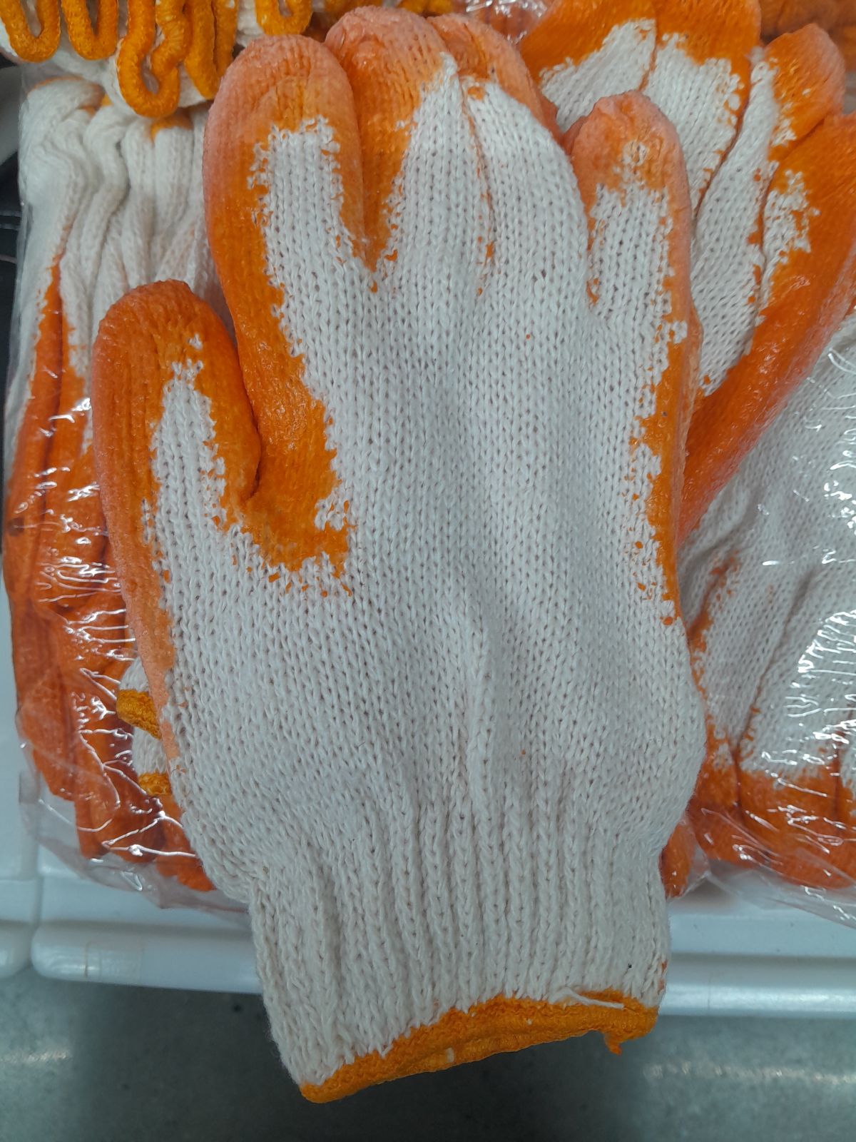 ถุงมือผ้าชุบยาง ตรามือ (ส้มขาว)